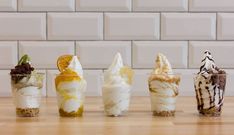 five different desserts are lined up on a table