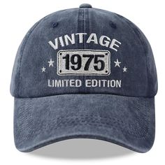 an old fashioned blue hat with the words vintage 1970 printed on it, and stars