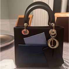 Elegant And Timeless Is This Dior Classic Handbag In Excellent Condition. Used Twice. Limited Edition And A Super Investment. Small Barely Seen Hairline Scratch ( In Pictures) And Makeup Stain That Can Be Professionally Removed Barely Seen. Otherwise Perfect. From The 2014 Collection. Attached Pockets To Hold Credit Card ..Rare Classic Handbags, Makeup Stain, Lady Dior, Dior Bag, Investment, Dior, Limited Edition, Credit Card, Stain