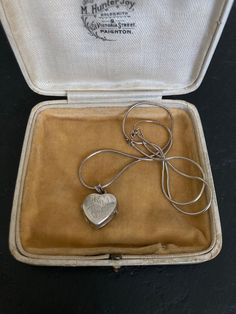 Beautiful 1970s VINTAGE SILVER Locket on a sterling silver 16 inch Chain. A lovely heart shaped Sterling Silver Engraved Pendant Necklace. 70s Vintage Silver Jewelry offered by Isobel Vintage Jewels on Etsy Style: Vintage 1970s real silver locket. A lovely heart 70s side opening sterling silver locket big enough for putting little photos inside.  Colour: silver  Size: 1.5 x 1.5 cm and 16 inch chain Condition: Excellent condition Approximate Date: 1970s Check out my other lovely silver items including this one: https://www.etsy.com/uk/listing/1269638336/70s-sterling-silver-ring-pretty-delicate Please note: ALL the items in my shop are vintage and have been previously worn. Items will show wear commensurate with their age and any major flaws will be noted and I really only sell items that ar Vintage Charm Heart Pendant Necklace For Anniversary, Anniversary Necklace With Vintage Charm And Heart Pendant, Retro Heart-shaped Necklace For Gift, Retro Heart-shaped Necklace Gift, Vintage Sterling Silver Jewelry For Memorial, Vintage Sterling Silver Jewelry For Memorials, Vintage Sterling Silver Jewelry For Anniversary, Retro Heart-shaped Jewelry Gift, Victorian Silver Locket Necklace With Heart Charm