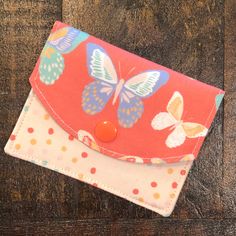 BUTTERFLIES Mini Wallet from TWO CHICKS SEW ----------------------------------------------------- MINI WALLETS are perfect for when you need to carry a few cards, your ID, and cash.   ~ 2-pocket design  ~ Secure snap closure ~ Fits in your pocket or a small purse. ~ 100% cotton fabric lined with interfacing for extra durability.  Measures approx. 4.25"wide X 3.25" tall ** ADD A CLIP ** ~ 1/2" silver metal lobster clasp ~ Attaches to your key ring, purse, or belt loop. ------------------------------------------------- ~ Mini Wallets are made by hand in our smoke-free home studio. ~ Pattern placement may vary from listing photos. ~ Colors may appear slightly different depending on your screen settings. ** If we have any questions about your order, we will message you over Etsy. A delay in yo Cute Bifold Wallets For Everyday Use, Cute Bifold Wallet For Everyday Use, Cute Everyday Bifold Wallet, Cute Everyday Coin Purse With Card Slots, Cute Rectangular Everyday Wallets, Cute Everyday Rectangular Wallets, Cute Handmade Wallets For Everyday Use, Cute Handmade Wallets For Everyday, Cute Red Wallets For Everyday Use