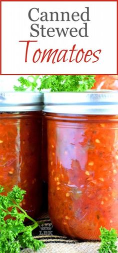 two jars filled with canned tomato sauce and garnished with parsley on the side