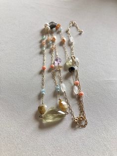 -delicate 14k gold filled necklace made of many semi precious gemstones: big faceted citrine nugget, white natural pearls, pink natural pearl, peach moonstone rondelles, oval faceted smoky quartz, oval faceted rutilated quartz, oval faceted amethyst, oval faceted prehnite, oval faceted moonstone, pyrite rondelles, emerald jade rondelles, pink coral bamboo rondelles, round cornelian beads, white jade rondelles, 14k gold filled round beads - 14k gold filled spring clasp  - 33.4inch (85,5cm) in len Gold Gemstone Beaded Lariat Necklace, Gold Lariat Beaded Necklace With Gemstone, Gold Double Strand Crystal Necklace With Natural Stones, Delicate Gold Beaded Necklaces With Natural Stones, Gold Beaded Necklaces With Natural Stones In 14k Gold, Gold Briolette Crystal Necklaces With Natural Stones, Gold Lariat Beaded Necklace With Natural Stones, Gold Double Strand Beaded Necklaces With Gemstones, Gold Double Strand Beaded Necklace With Gemstone