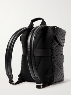 Beyond its artistic integrity, Bottega Veneta actually first devised its intrecciato weave to make leather stronger and more durable. This backpack is woven in a roomy, boxy shape and topped with a buckled lid. It's certainly sleek enough to work with tailoring and other smart outfits. Luxury Textured Leather Backpack, Designer Leather Bags With Interwoven Design, Luxury Leather Backpack With Leather Trim, Designer Woven Leather Travel Bag, Designer Travel Bag With Woven Leather, Travel Bags With Interwoven Design, Leather Travel Bag With Interwoven Design, Designer Travel Bags With Interwoven Design, Smart Outfits