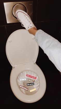 a person standing on top of a toilet seat