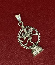 Indian Hindu Idols god Shiva Natraja (dancing shiva called Natraja)sitting on lotus flower design vintage antique style pendant, best gifting unisex jewelry from India. Metal-925 sterling silver. Item type-Pendant/ Locket Weight-7.720 grams. Height-4.9 centimeter. Width-2.5 centimeters. Stamped-925. Finish-Oxidized. note: chain is not included in this price. Make excellent gifting and collectible pieces(gifts for birthdays, weddings, anniversaries, mother's day, fathers day, Christmas day,) We t Spiritual Oxidized Jewelry For Puja, Traditional Silver Jewelry With Charms, Sterling Silver Engraved Jewelry For Puja, Sterling Silver Round Pendant Jewelry For Festivals, Antique Silver Jewelry For Festivals As A Gift, Antique Silver Jewelry For Festivals And Gifts, Engraved Sterling Silver Jewelry For Puja, Antique Silver Jewelry For Festival Gifts, Spiritual Engraved Jewelry For Navratri