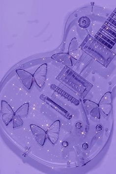 an electric guitar with butterflies on the body and lights in the shape of butterfly wings