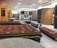 a room filled with lots of different rugs