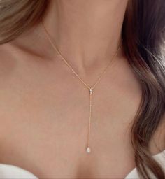 * DETAILS * (The drop on the necklace is 3 inches.) * Gold Plated Necklace  -Teardrop Shape Synthetic White Pearls - 18K Gold Plated Dainty Cable Chain - Gold plated CZ Paved Connector - 14k Gold Filled Spring Ring Clasp  👉🏻For more Y-necklaces, see https://www.etsy.com/shop/JinnysJewelryBySeJin * CARE TIPS * ⭐️TO PREVENT TARNISH: Keep your jewellery in airtight plastic bags. It won't tarnish if it isn't exposed to air. The worst place to leave your jewellery is in a steamy bathroom. Wipe with White Lariat Drop Necklace With Pearl, Gold Dangle Bridal Necklace For Anniversary, Delicate Drop Necklace With Clavicle Chain, Teardrop Pearl Chain Necklace, Adjustable Pearl Drop Necklace, White Dangle Drop Necklace With Adjustable Chain, Adjustable Pearl Pendant Drop Necklace, Elegant Pearl Drop Dangle Necklace, Formal Dangle Lariat Necklace With Pearl Drop