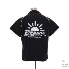 the back of a black shirt that says sunberg construction co, on a mannequin