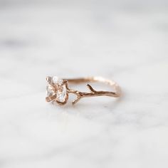 Our dainty Crystal Quartz Ring is part of our new Birthstone Ring Collection! This beautiful, yet delicate ring is made with top-quality, genuine, colorless Clear Crystal Quartz. The April Birthstone represents purity + healing. Not to mention, the unique look of the whimsical vine ring setting will ensure endless compliments. If you're looking for a ring with style, quality and true meaning, look no further. ---------------------- FEATURES ◊ Oval shaped, brilliant cut faceted genuine Clear Crys Delicate Crystal Ring With Rose Cut Diamonds For Gift, Delicate Moonstone Diamond Ring Gift, Dainty Birthstone Ring With Rose Cut Diamonds As Gift, Delicate Rose Cut Diamond Rings For Gifts, Delicate Rose Cut Diamond Ring Gift, Delicate Crystal Gemstone Ring For Promise, Delicate Crystal Ring For Anniversary, Nature-inspired Rings With Rose Cut Diamonds For Gift, Nature-inspired Rings With Rose Cut Diamonds As Gift