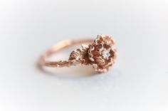 "This peony ring is carved from wax by our master wax Carver, then cast into 14k gold. The flowers sit on top of the band, which makes this ring stackable. This listing is for 1 peony ring only, a matching twig band is available to be purchased separately here. >>https://etsy.me/38jaDG1 Peony Meaning \"The peony is named after Paeon, a physician to the gods, who received the flower on Mount Olympus from the mother of Apollo. The traditional floral symbol of China, the state flower of India Elegant 14k Gold Flower Ring With Rose Design, Elegant Flower Shaped Ring With Rose Cut Diamonds, Elegant Flower Ring With Rose Cut Diamonds, Heirloom Rose Gold Flower Ring, Elegant 14k Gold Flower Ring With Rose Cut Diamonds, Elegant 14k Gold Rose Design Ring, Elegant Rose Gold Flower Ring In 14k, Elegant 14k Rose Gold Flower Ring, Elegant Flower Ring With Rose Design