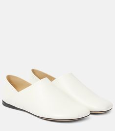 Toy leather slippers in white - Loewe | Mytheresa Elegant Slip-on Slippers With Round Toe, Elegant Calf Leather Closed Toe Slip-ons, Elegant Slip-on Slippers With Leather Sole, White Leather Slip-ons With Stitched Sole, Luxury Leather Flat Slip-ons, Leather Slip-ons With Flat Heel And Leather Sole, Elegant Slip-on Mules With Stitched Sole, Elegant White Leather Slip-ons, Chic Leather Slip-ons With Textured Sole