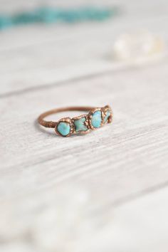 Your turquoise and copper ring collection is not complete without a multi stone raw turquoise ring. Handmade with healing crystals and natural stones, this copper jewelry awakens the wild woman. The raw turquoise jewelry is made with electroformed copper, making each piece unique and one of a kind, just like you. Embrace your intuitive nature and click through to see more raw gemstone jewelry! Bohemian Raw Stone Rings For Healing, Bohemian Rings With Raw Stone For Healing, Bohemian Raw Stone Healing Rings, Bohemian Rings With Raw Stone, Bohemian Turquoise Chrysocolla Ring With Natural Stones, Bohemian Turquoise Ring With Natural Chrysocolla, Bohemian Turquoise Ring With Chrysocolla, Bohemian Chrysocolla Turquoise Ring, Handmade Turquoise Bohemian Promise Ring