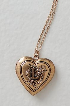 A super sweet gift or an accessory unique to you, this darling monogram necklace features a heart locket pendant with an initial engraving. **Features:** Dainty chain, heart locket pendant, hinge opening mechanism, monogram initial engraving, clasp closure **Why We | Monogram Necklace by Free People in Gold Gifts To Get Your Bf For Christmas, Pendant Name Necklace, Initial Jewelry Silver, Unique Initial Necklace, Hearing Gifts For Him, Gold Locket Aesthetic, Cute Lockets Necklaces, Locket Outfit, 2005 Necklace