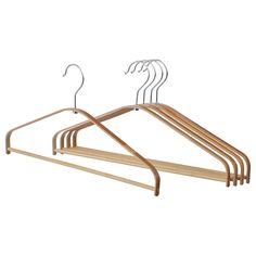 a wooden hanger with four pairs of clothes on it