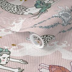 a pink wallpaper with an image of mermaids on it