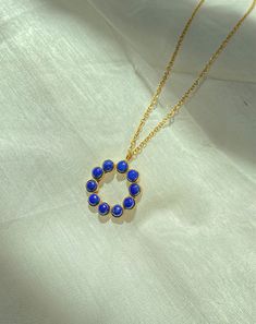 Chloe means blossom. This beautiful and dainty necklace is handmade using finest lapis lazuli which are feather light in weight on 18k gold plated brass. Gold Lapis Lazuli Spiritual Necklace, Blue Spiritual Gold-plated Necklaces, Bohemian Gold Lapis Lazuli Necklace, Blue Dainty Necklace With Flower Pendant, Blue Dainty Flower Pendant Necklace, Dainty Blue Flower Pendant Necklace, Gold Lapis Lazuli Necklace As A Gift, Gold Lapis Lazuli Pendant Necklace, Gold Lapis Lazuli Necklace For Gift