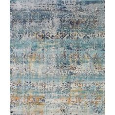 an area rug with blue, yellow and orange colors on it's edges is featured in this image