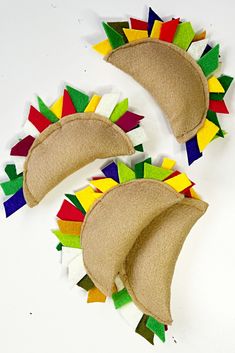 three pieces of felt that have been made to look like tacos on top of each other