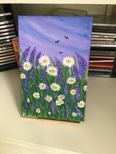 a painting of flowers and birds on a shelf