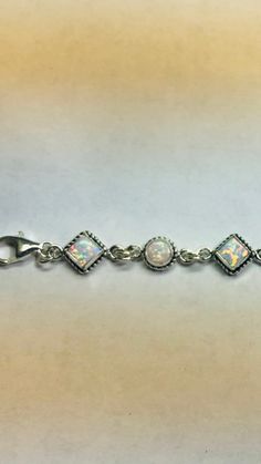 *Bracelet size is 8 inches long including extensions *Jewelry send out In Gift box *Sterling silver bracelet .925 *lab created opal *Handmade in Albuquerque NM.USA *Cabochons color may vary *Ship out within 48 hours guarantee on business days. Thank You For Your Looking ,And Check Out More Items In My Etsy Shop For More Great Deals, Also We Add More Jewelry To Etsy Shop Regularly https://www.etsy.com/shop/ABQdesign Classic Sterling Silver Bracelet With Extender As Gift, Classic White Adjustable Charm Bracelet, Classic Adjustable White Charm Bracelet, Adjustable Sterling Silver Bracelets With Extender, White Jewelry With Extender As A Gift, White Jewelry With Extender For Gift, White Sterling Silver Jubilee Bracelet Gift, Classic Sterling Silver Jewelry With Extender, Classic White Jewelry With Extender