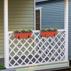 two planters on the back porch of a house