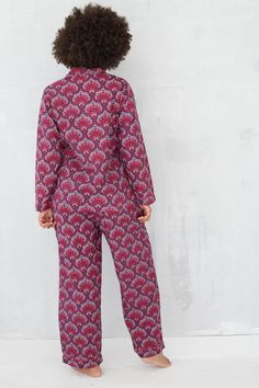 Super soft organic cotton! Beautiful Pichola print in gorgeous berry tones. Hand-screen printed on super soft 100% organic cotton, with contrast piped edging. This long-sleeve pj set includes a classic long-sleeve shirt, paired with our comfy, wide-leg pj trousers, complete with drawstring front, side-seam pockets and gently elasticated waist. Details: Drawstring waist Pockets Block printed Piped edging Chest pocket Button fronted Long-sleeved Gentle eco dyes 100% organic cotton Fit: I would say Home Cotton Sets For Fall, Cotton Sets For Home Use In Fall, Cotton Home Sets For Fall Season, Fall Cotton Home Sets, Fall Home Cotton Sets, Patterned Cotton Long Sleeve Sleepwear, Organic Cotton Long Sleeve Sleepwear For Sleepover, Patterned Printed Long Sleeve Sleepwear, Pink Cotton Sleepwear For Fall