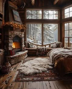 a bedroom with a fireplace and lots of windows