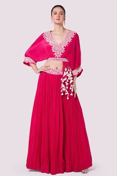 Buy pink embellished baggy sleeves top online in USA with skirt. Shop the best and latest designs in embroidered sarees, designer sarees, Anarkali suit, lehengas, sharara suits for weddings and special occasions from Pure Elegance Indian fashion store in USA.-full view Embellished Pink Georgette Palazzo Set, Embroidered Pink Palazzo Set For Party, Pink Georgette Palazzo Set For Party, Pink Embellished Blouse With Traditional Drape, Pink Anarkali Skirt Set For Party, Pink Long Sleeve Georgette Palazzo Set, Pink Party Skirt With Traditional Drape, Pink Embroidered Wedding Skirt, Embroidered Pink Wedding Skirt