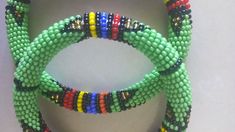 Beaded Bracelets | African Maasai Beaded Bracelets | African Jewelry | Zulu Beaded Bracelets | Ethnic Bracelets | Gift For Her | A Set Of Two These superbly crafted Zulu beaded bracelets are made of fine beads. The price is for a set of two bracelets. Main Color - Green. Size - Standard measurement is 7 - 8 inches. For smaller or larger bracelets please contact me. Available in different colors. Feel free to send me a convo or e-mail for any clarification. Thank you for visiting... Green Beaded Bangle Bracelets For Festival, Traditional Green Beaded Bracelets For Festival, Green Bead Bracelet For Festivals, Traditional Festival Braided Bracelets With Round Beads, Traditional Braided Bracelets With Round Beads For Festivals, Green Bracelets With Colorful Beads For Festival, Traditional Green Beaded Bracelets With Large Beads, Traditional Multicolor Braided Bracelets With Round Beads, Green Colorful Beads Festival Bracelet