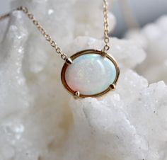 "Every Opal is Unique in its own way. Each stone has its own color variation, showing off hints of blue, purple, pink, green and red. - Oval Australian Opal measures 8 x 10mm - Choose your length: 14\" - 15\" - 16\" - 17\" - 18\" - Available in rose, white or yellow gold Processing times - Current processing time is 1 - 3 weeks. Each Item is handmade to order with love and care! In Stock Items - Contact Liesel Love with any rush order questions, or to see if we have anything ready made and in st Opal Gemstone Oval Pendant Necklace, Oval Ethiopian Opal Birthstone Jewelry, Ethiopian Opal Oval Pendant Jewelry Gift, Handmade Oval Ethiopian Opal Necklaces, Handmade Oval Ethiopian Opal Necklace, Opal Gemstone Necklace In Oval Cabochon Shape, Opal Gemstone Necklace With Oval Cabochon, Opal Oval Cabochon Gemstone Necklace, Ethiopian Opal Cabochon Oval Pendant Jewelry