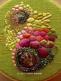 a close up of a piece of art with beads