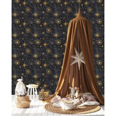 a child's room with stars and planets on the wall, including a teddy bear