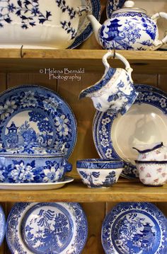 blue and white china on display in a store