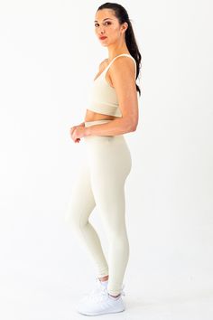 The Contrast Legging in Cream embodies a union of function and aesthetic. Crafted from moisture-wicking, 4-way stretch power fabric, the garment is lightweight, breathable, and functional. The minimal design is discreetly elevated through the inclusion of ribbing detail down the side of the legs as well as around the glutes. Branding details include an inconspicuous SLAIT logo in reflective detail located on the back of the waistband. Material: 87% Nylon & 13% Spandex GSM: 280G Model is 5'8" and wears a size M Compressive Seamless Beige Activewear, Compressive Beige Seamless Activewear, Compressive Beige Activewear For Gym, Beige Compressive Activewear For Workout, Beige Compression Seamless Activewear, Beige Seamless Compression Activewear, Functional 4-way Stretch Seamless Leggings, Beige Compression Activewear For Workout, Functional Seamless 4-way Stretch Leggings