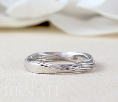 "Exclusive to Benati. A new meaningful, contemporary mobius inspired wedding band. A rectangle profile - one side of the ring are made to a high polish and one made with wood finish to enhance to mobius effect. This ring has 4 twists, so it is very interesting from every angle. No beginning or end. Made from solid 14k/18k gold or platinum. Width of ring is approx.: 3 mm (0.11\"). This mobius ring also makes for the perfect dream wedding ring for those that enjoy a more simplistic style. It also Modern Promise Ring, Modern Twist Stackable Rings For Formal Occasions, Anniversary Stackable Rings With Modern Twist, Silver Stackable Rings With Modern Twist For Wedding, Modern Twist Stackable White Gold Wedding Rings, Infinity Rings With Polished Finish For Wedding, Infinity Wedding Rings With Polished Finish, Modern Twist Stackable Promise Rings, Modern Infinity Stackable Rings For Anniversary