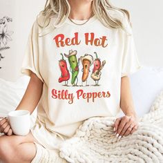 Presenting our Red Hot Silly Peppers parody music graphic tee! This unique and original design is perfect for both adults and youth. Tees are unisex regular fit, in soft combed-cotton fabric. Color "Ivory" is a comfort colors tee for adults, which is a heavier 100% cotton tee. Color "Ivory" is a Bella + Canvas Tee in youth. For an oversized look, please consider sizing up.  Premium Quality: Crafted with love and attention to detail, our graphic tees are made using ultra soft and comfortable cott Western Tees, Western Tee, Oversized Look, Funny Vintage, Band Shirt, Funny Graphic Tees, Bella Canvas Tees, Comfort Colors Tee, Cozy Fits