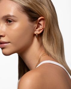 Why We Love Them: As simple as it comes, this chic, solid gold stud is perfect for second, third, and cartilage piercings. Classic 14k Rose Gold Huggie Earrings, Classic Rose Gold 14k Huggie Earrings, Classic Hypoallergenic Huggie Jewelry, Everyday White Gold Plated Huggie Earrings, Dainty Yellow Gold Huggie Jewelry, Minimalist Gold Huggie Jewelry, Everyday Hypoallergenic 14k Gold Jewelry, 14k Gold Single Earring For Everyday, Timeless Yellow Gold Huggie Earrings Tarnish Resistant