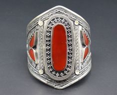 Vintage Turkmen traditional alpaka cuff bracelet. Its 100% hand crafted workmanship with beautiful glass Carnelian stones and lovely carved design. Please do not hesitate to contact if you have any questions. Weight : 67.2 grams, Opening of the mouth : 1.6" ( 4cm ) Inner circumference : 14 cm ( 5.5" ) Width : 8cm ( 3.2" ) Please know what you are bidding on. The metal of Most Kuchi, Afghan and Turkoman items are called with different names, Some called Alpaca silver, German Silver and Tibetan Si Artisan Cuff Bracelet As Festival Gift, Vintage Carnelian Bracelets As Gift, Vintage Carnelian Bracelets Gift, Vintage Carnelian Bracelet Gift, Traditional Red Cuff Bracelet As Gift, Silver Carnelian Bracelets As Gift, Silver Carnelian Bracelet As A Gift, Silver Carnelian Bracelet Gift, Traditional Inlay Cuff Bangle Bracelet