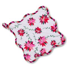 a white and pink floral pot holder with red flowers on it's back side