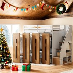 there is a christmas tree in front of the bunk bed with stairs and ladders