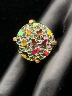 "This color changing set is oh so pretty; each round 'stone' in the bracelet and clip earrings is set in a decorative brass colored metal which measures 1 1/2\" long by 1 1/2\" wide; the ring is set in a simple setting of the same colored metal; depending on the angle, the colors reflect blue, pink, green, yellow or orange; bracelet is 7 1/2\" long, and each 'stone' is 7/8\" round; dress up or down." Adjustable Gold Clip-on Jewelry, Handmade Iridescent Round Jewelry, Metal Clip-on Round Jewelry, Multicolor Metal Clip-on Earrings, Multicolor Jewelry With Matching Round Earrings, Multicolor Brass Jewelry For Gift, Multicolor Collectible Ring Jewelry, Oval Metal Clip-on Jewelry, Iridescent Vintage Jewelry For Collectors