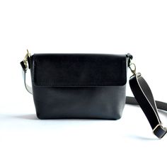 We have nothing but love for this bag! Harlow transforms seamlessly from clutch to a hands-free bag with strap. With an adjustable strap, you can transition from crossbody to a shoulder bag and any length between.Black LeatherBlack Leather StrapBrass Hardware ... • Fast & FREE Shipping on orders over $150• Made with a single piece of Full-Grain leather• Magnetic snap closure• Open interior pocket• Measurements: 10.5" wide across top, 9” wide across bottom, 6.5" high, 2.5" deep• Removable adjusta Everyday Belt Bag With Detachable Strap Clutch, Everyday Clutch Belt Bag With Detachable Strap, Chic Everyday Belt Bag With Adjustable Strap, Modern Black Flap Bag With Adjustable Handle, Versatile Everyday Clutch Flap Bag, Classic Flap Bag With Adjustable Handle For Everyday, Everyday Belt Bag With Detachable Strap, Classic Flap Bag With Adjustable Handle, Classic Crossbody Belt Bag For Everyday