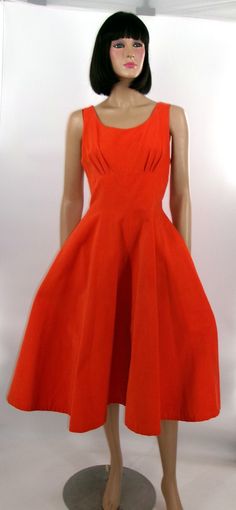 "Offered for sale is this handsome, tangerine, fine wale corduroy sleeveless dress with a fitted bodice and a gored skirt meticulously sewn to create fullness.  Gores are triangular segments, narrow at the top and wider at the base, subtly inserted to extend the width from the waistline to the hem of the skirt.  The dress has a back zipper for closure and two invisible pockets at each side.  It measures 15.5\" across its bust line or 31\" around and 13.5\" across its waist or 27\" around.  The o Retro Orange Lined Dress, Vintage Orange A-line Dress, Orange 1950s Dress, Bohemian Jackets, Gored Skirt, Corduroy Dress, 1950s Vintage, Fitted Bodice, Dress Clothes For Women