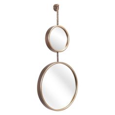 two round mirrors hanging on a rope against a white background, one is gold and the other is silver