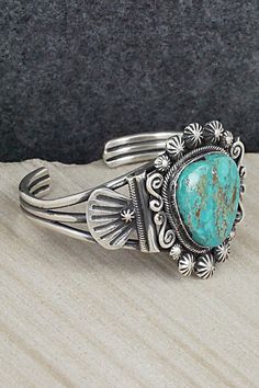 This beautiful turquoise and sterling silver bracelet was made by Navajo silversmith Jess Martinez. The inside is signed and stamped sterling.Size: 5 1/2" (will fit up to a 6 1/2" wrist)Gap: 1"Width: 1 5/8"Free shipping on all orders! We ship with USPS and always include tracking. All orders ship within a day of payment.Returns are accepted up to 30 days after you receive your order. Just send us a message. Our shop offers cash back or store credit. The item must be returned in new condition. Sterling Silver Turquoise Concho Jewelry, Stamped Turquoise Bracelet, Turquoise Stamped Bracelet, Bohemian Engraved Turquoise Sterling Silver Bracelet, Bohemian Turquoise Engraved Sterling Silver Bracelet, Bohemian Engraved Turquoise Bracelets, Engraved Turquoise Bohemian Bracelets, Collectible Bohemian Turquoise Bracelets, Bohemian Turquoise Bracelets Collectible