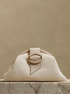 Stella Straw Clutch | Banana Republic Chic Beige Straw Bag, Chic Cream Straw Bag, Chic Straw Bag With Leather Handles, Chic Neutral Straw Bag, Elegant Evening Straw Bag With Leather Handles, Chic Straw Clutch With Braided Handles, Chic Natural Clutch For Spring, Elegant Beige Straw Bag With Gold-tone Hardware, Chic Beige Woven Clutch