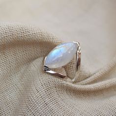 Gemstone - Natural Rainbow MoonstoneGemstone Size - 11x22 mm marquise Metal - Sterling Silvernatural AAA rainbow moonstone set with a sterling silver handmade ring Each Ring made with Precision and love, these rings are perfect for everyday use and a perfect accessory to wear at work. Rings can be customized on request and gemstone can be switched to any other as per requirement. Other beautiful designs uploaded with fabulous gemstones. kindly visit my store to view the complete collection. Feel Silver Marquise Moonstone Ring, White Marquise Rings For Gift, White Marquise Rings For Gifts, Moonstone Marquise Jewelry As A Gift, Moonstone Marquise Jewelry For Gift, Marquise Cut Moonstone Ring Gift, Silver Marquise Crystal Ring Gift, Marquise Silver Crystal Ring Gift, Rainbow Moonstone Jewelry