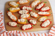 stuffed bell peppers are on a cutting board and ready to be served for the guests